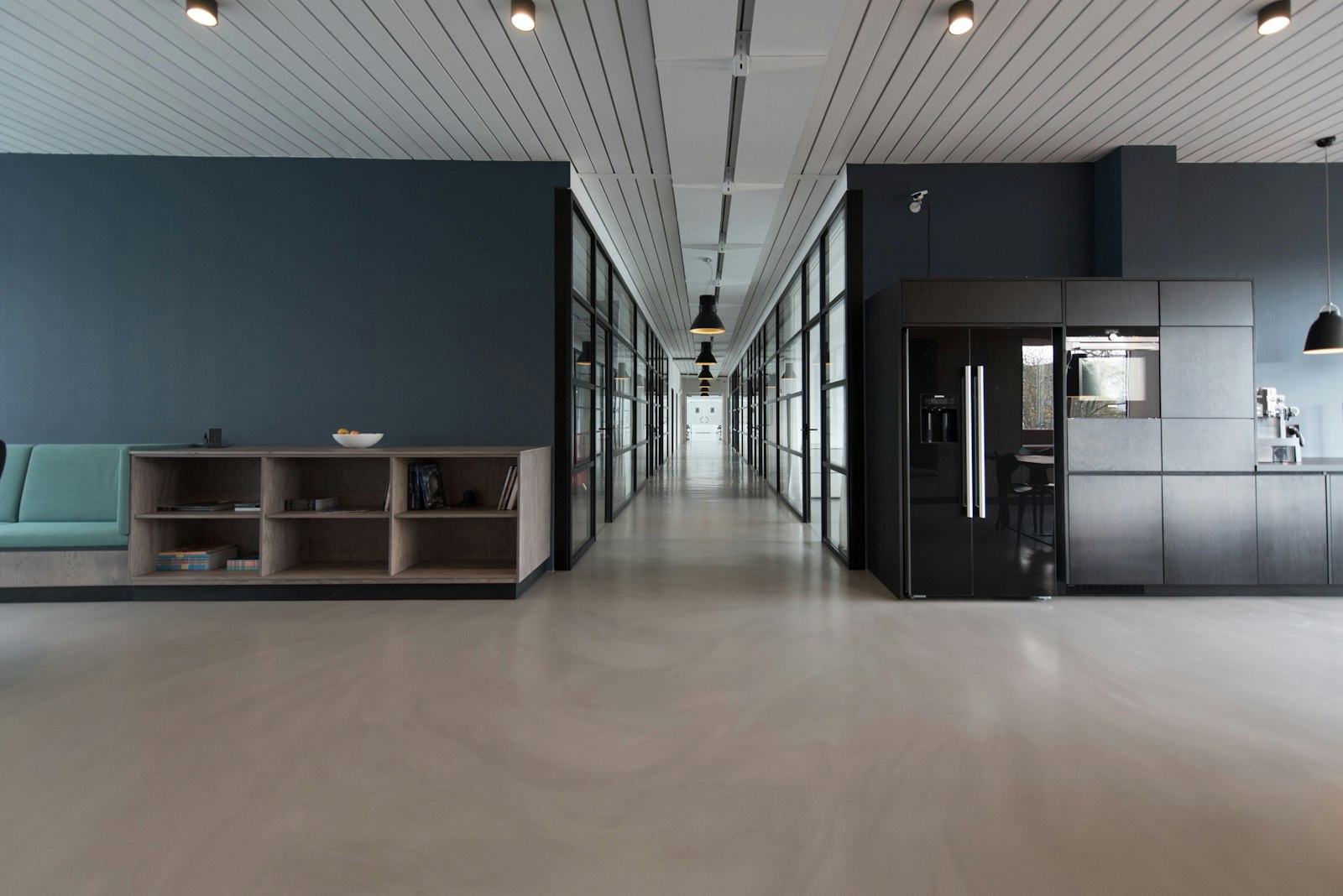 Open commercial office interior with desks and natural light