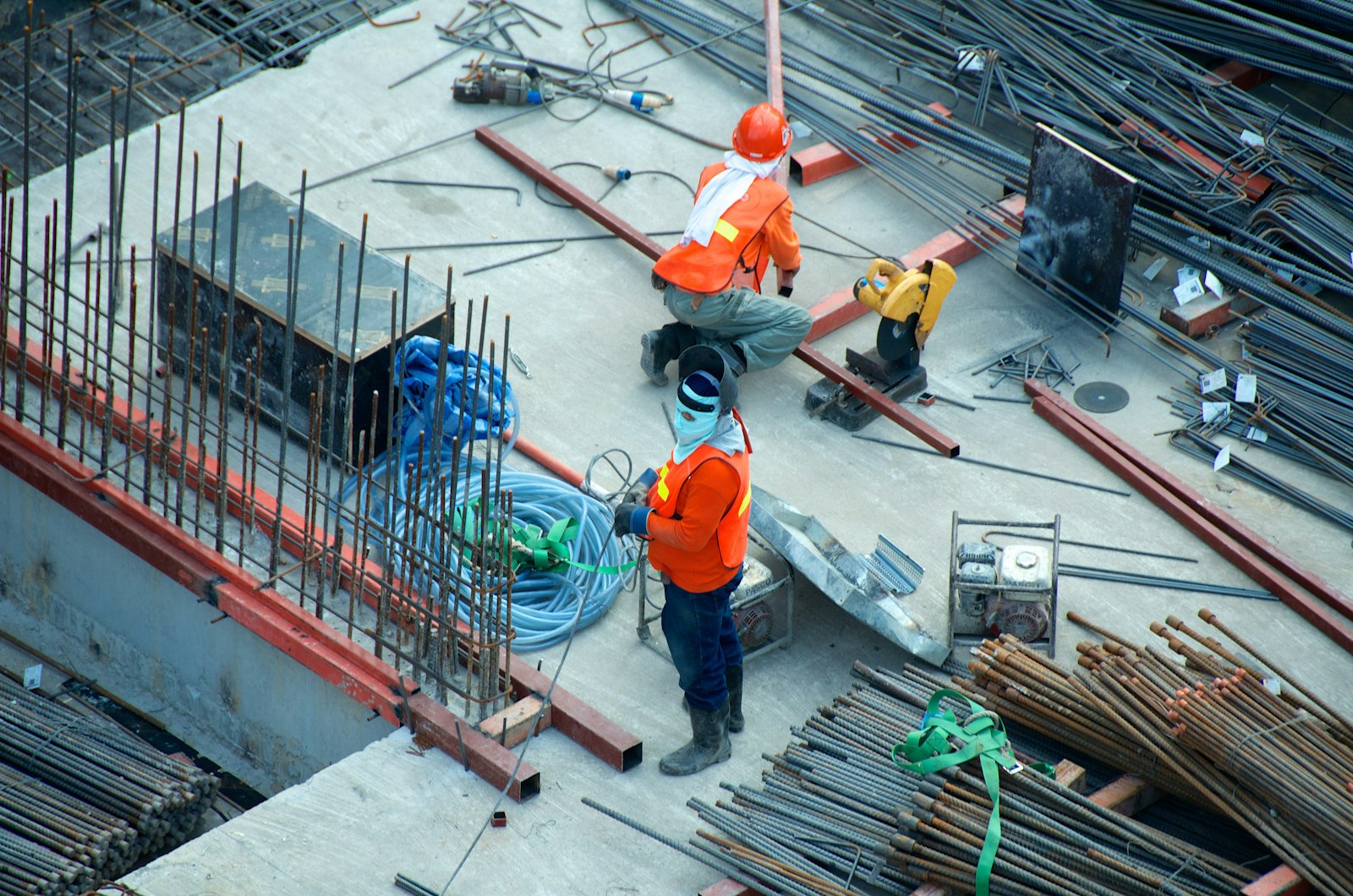 Active construction site with workers and scaffolding
